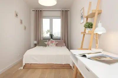 Łóżko lub łóżka w pokoju w obiekcie Modern & Bright Apartment with Parking and Balcony by Noclegi Renters