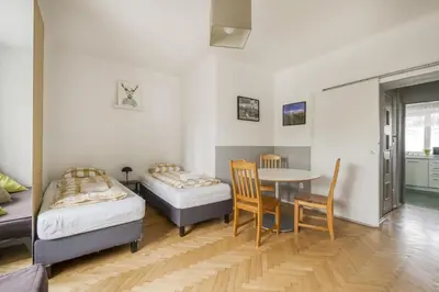 Łóżko lub łóżka w pokoju w obiekcie Labo Apartment Nowolipie
