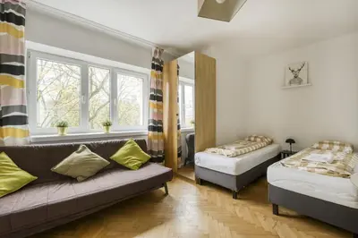Łóżko lub łóżka w pokoju w obiekcie Labo Apartment Nowolipie