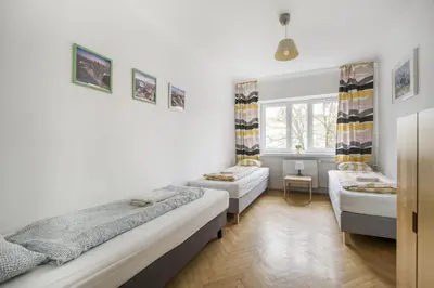 Łóżko lub łóżka w pokoju w obiekcie Labo Apartment Nowolipie
