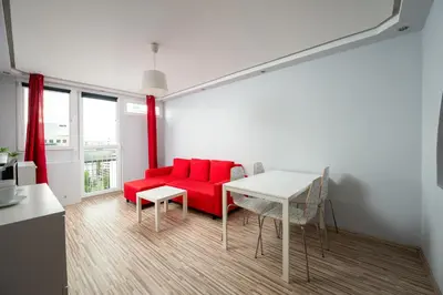 Część wypoczynkowa w obiekcie Krochmalna Red Apartment by BookingHost