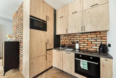 Kuchnia lub aneks kuchenny w obiekcie Woronicza 80 Modern Studio by BookingHost