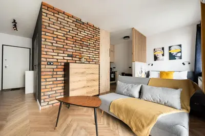 Łóżko lub łóżka w pokoju w obiekcie Woronicza 80 Modern Studio by BookingHost