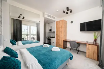 Łóżko lub łóżka w pokoju w obiekcie New Varsovia Comfort 546 by BookingHost