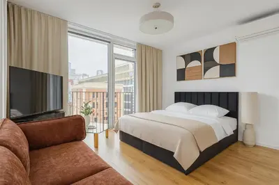 Łóżko lub łóżka w pokoju w obiekcie BROWARY DESIGNER APARTMENTS by Country 2 Country