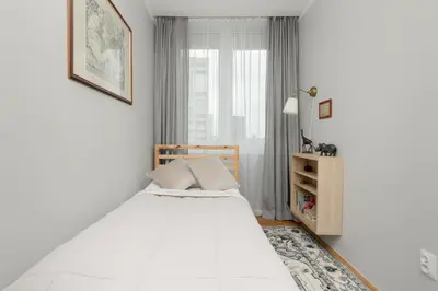 Łóżko lub łóżka w pokoju w obiekcie Cozy Two-Bedroom Apartment Mokotow by Noclegi Renters