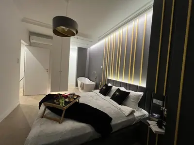 Łóżko lub łóżka w pokoju w obiekcie VipWarsawApartments pl Gold Mennica Residence