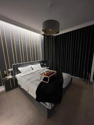 Łóżko lub łóżka w pokoju w obiekcie VipWarsawApartments pl Gold Mennica Residence