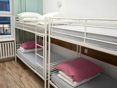 Łóżko lub łóżka w pokoju w obiekcie Hostel Vasylok - Warszawa Wschodnia & Stadion Narodowy