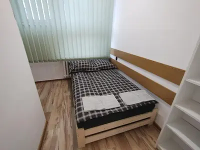 Łóżko lub łóżka w pokoju w obiekcie Hostel Vasylok - Warszawa Wschodnia & Stadion Narodowy