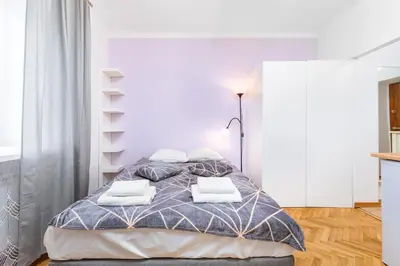 Łóżko lub łóżka w pokoju w obiekcie Szymanowskiego 4 by Homeprime