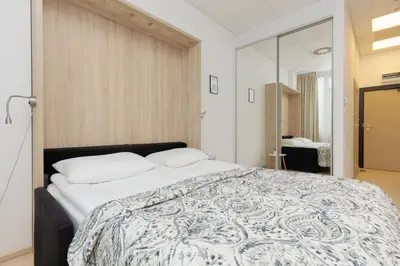 Łóżko lub łóżka w pokoju w obiekcie Studio Jerozolimskie 216 with Parking by Noclegi Renters