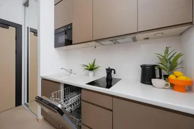 Kuchnia lub aneks kuchenny w obiekcie Studio Jerozolimskie 216 with Parking by Noclegi Renters