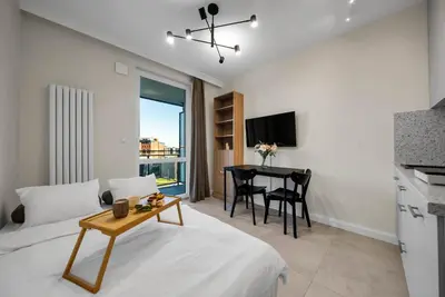 Telewizja i/lub zestaw kina domowego w obiekcie Wiktoryn Studio - Balcony, Gym & Sauna - by Rentujemy