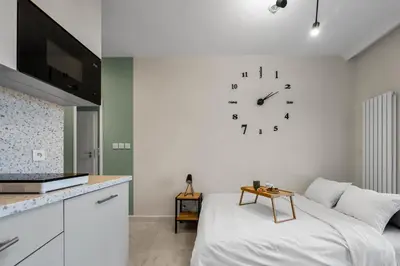 Łóżko lub łóżka w pokoju w obiekcie Wiktoryn Studio - Balcony, Gym & Sauna - by Rentujemy