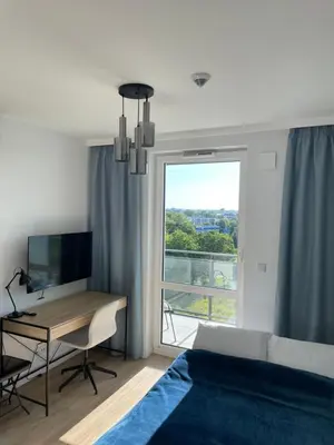 Telewizja i/lub zestaw kina domowego w obiekcie Cubus Nest Apartment