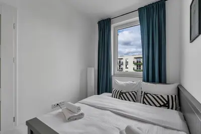 Łóżko lub łóżka w pokoju w obiekcie Włochy Klinkierowa Comfort Apartment by BookingHost