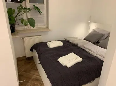Łóżko lub łóżka w pokoju w obiekcie Close Wola Studio