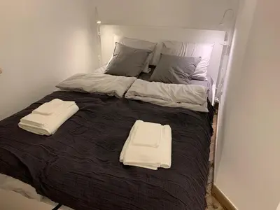 Łóżko lub łóżka w pokoju w obiekcie Close Wola Studio