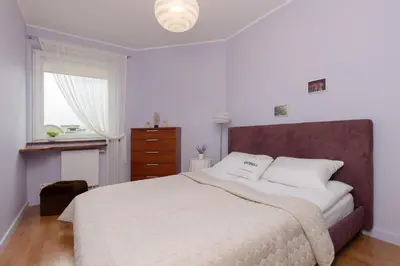 Łóżko lub łóżka w pokoju w obiekcie Cozy Apartment with Parking in Warsaw Ursus by Noclegi Renters