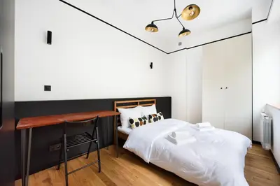 Łóżko lub łóżka w pokoju w obiekcie Uniwersytet Warszawski Modern Apartment by BookingHost