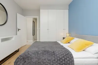 Łóżko lub łóżka w pokoju w obiekcie Modern Apartment with Balcony Mokotów Business Centre by Noclegi Renters