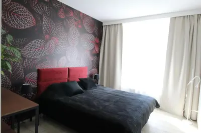 Łóżko lub łóżka w pokoju w obiekcie NEW Apartment Mona Warsaw Red