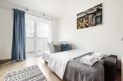 Łóżko lub łóżka w pokoju w obiekcie Praga Bliska Comfort Studio by BookingHost