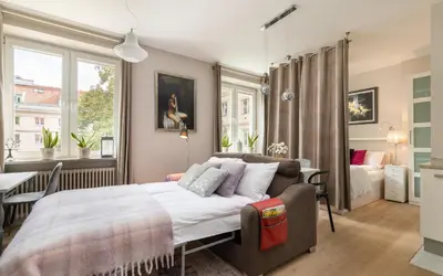 Łóżko lub łóżka w pokoju w obiekcie Cosy Studio Nowy Świat Śródmieście by Noclegi Renters