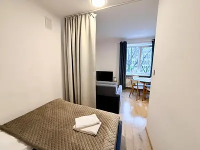 Łóżko lub łóżka w pokoju w obiekcie OhMyHome - Hala Mirowska
