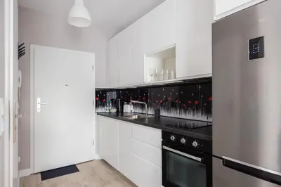 Kuchnia lub aneks kuchenny w obiekcie Praga Jagiellońska Comfort Studio by BookingHost