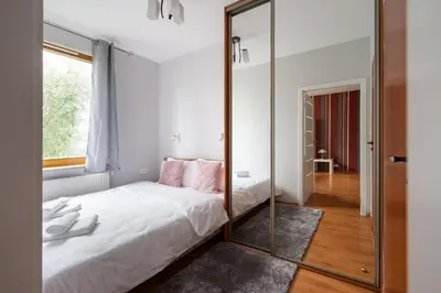 Łóżko lub łóżka w pokoju w obiekcie Obrzeżna Standard Apartment by BookingHost