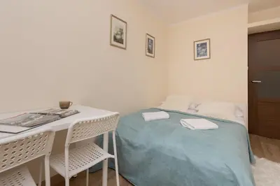 Łóżko lub łóżka w pokoju w obiekcie Dickens St Apartment Warsaw by Noclegi Renters