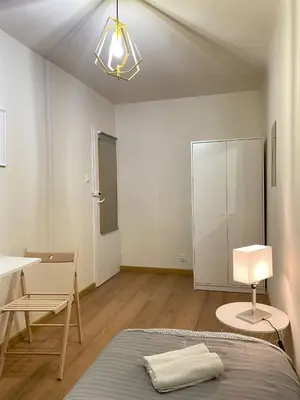 Łóżko lub łóżka w pokoju w obiekcie HALBY rooms Pereca 13/19