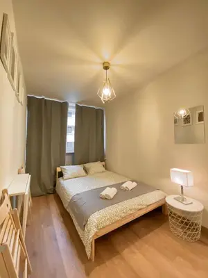Łóżko lub łóżka w pokoju w obiekcie HALBY rooms Pereca 13/19