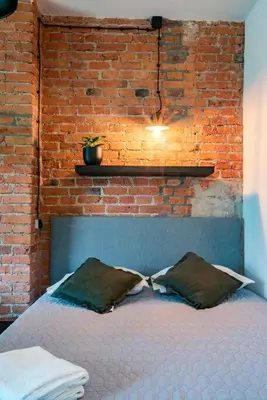 Łóżko lub łóżka w pokoju w obiekcie Cozy Studio 5 minut by Warsaw East