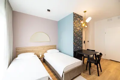 Łóżko lub łóżka w pokoju w obiekcie B85 Suites