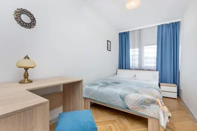 Łóżko lub łóżka w pokoju w obiekcie Cozy and Comfortable Wola Apartment by Noclegi Renters