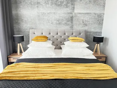 Łóżko lub łóżka w pokoju w obiekcie Wola Tower Deluxe Separate Bedroom with Free Garage - by Perfect Apart
