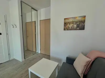 Część wypoczynkowa w obiekcie Studio Apartment Raspberry by Galeria Północna