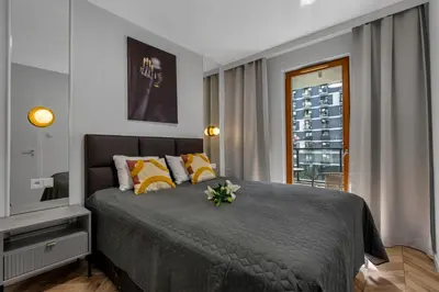 Łóżko lub łóżka w pokoju w obiekcie Kasprzaka 29A Business Apartments N1 - Parking, Balcony, Targi Expo - by Rentujemy