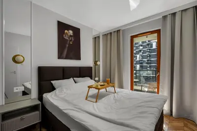 Łóżko lub łóżka w pokoju w obiekcie Kasprzaka 29A Business Apartments N1 - Parking, Balcony, Targi Expo - by Rentujemy