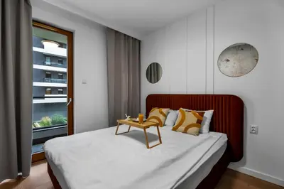 Łóżko lub łóżka w pokoju w obiekcie Kasprzaka 29A Business Apartments N2 - Parking, Balcony, Targi Expo - by Rentujemy