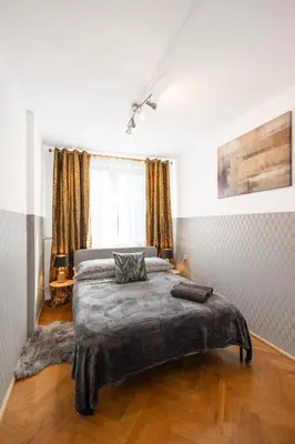 Łóżko lub łóżka w pokoju w obiekcie ClickTheFlat Stawki Apart Rooms