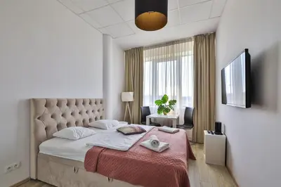 Łóżko lub łóżka w pokoju w obiekcie Al. Jerozolimskie 216 Perfect Apart