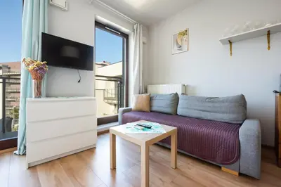 Telewizja i/lub zestaw kina domowego w obiekcie Wola Burakowska Comfort Studio by BookingHost