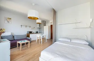 Łóżko lub łóżka w pokoju w obiekcie Wola Burakowska Comfort Studio by BookingHost