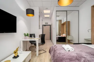 Łóżko lub łóżka w pokoju w obiekcie Al Jerozolimskie 216 APART-WAWA