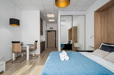 Łóżko lub łóżka w pokoju w obiekcie Al Jerozolimskie 216 APART-WAWA