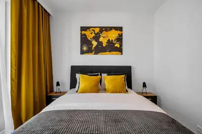 Łóżko lub łóżka w pokoju w obiekcie Lotnisko Chopina Modern Studio